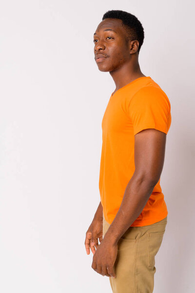 Studio shot of young handsome African man with Afro hair against white background