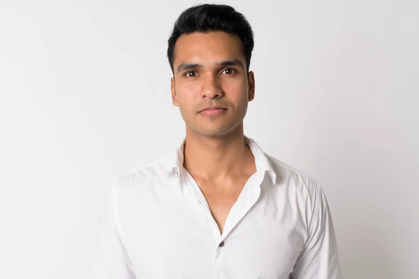 Studio shot of young handsome Indian man — Stock Photo, Image