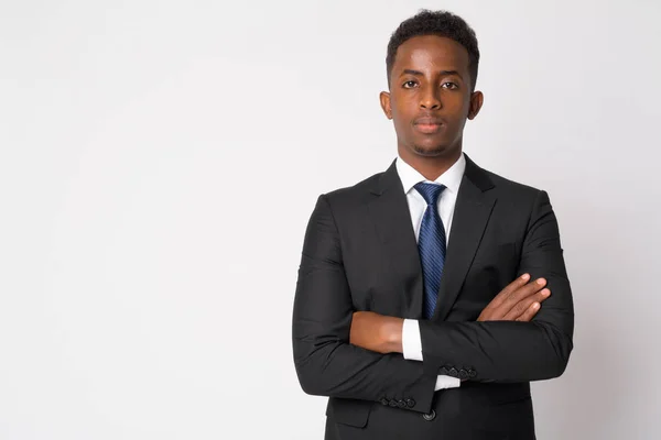 Portrait of young African businessman in suit with arms crossed — Stock Photo, Image