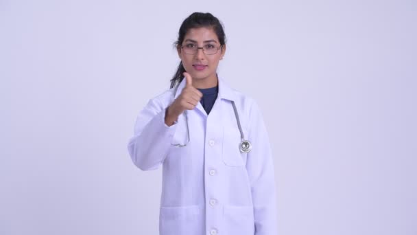 Young happy Persian woman doctor giving thumbs up — Stock Video