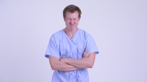 Angry young man patient with arms crossed — Stock Video