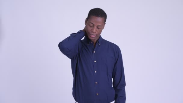 Young stressed African businessman having neck pain — Stock Video