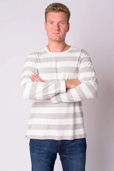 Portrait of young blonde man with arms crossed — Stock Photo, Image