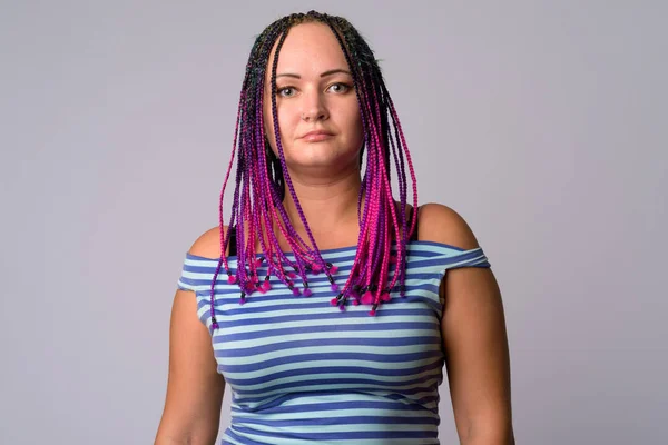 Portrait of rebellious woman with dreadlocks looking at camera — Stock Photo, Image