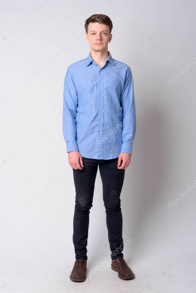 Full body shot of young handsome businessman