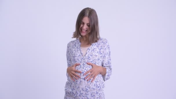 Happy young pregnant woman being interviewed — Stock Video