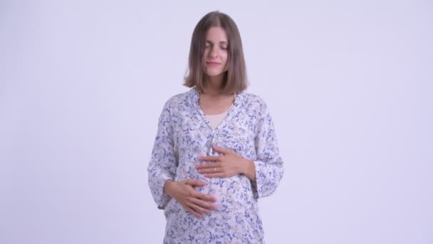 Confus jeune femme enceinte haussant les épaules — Video