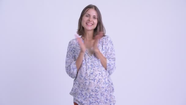 Happy young pregnant woman clapping hands — Stock Video