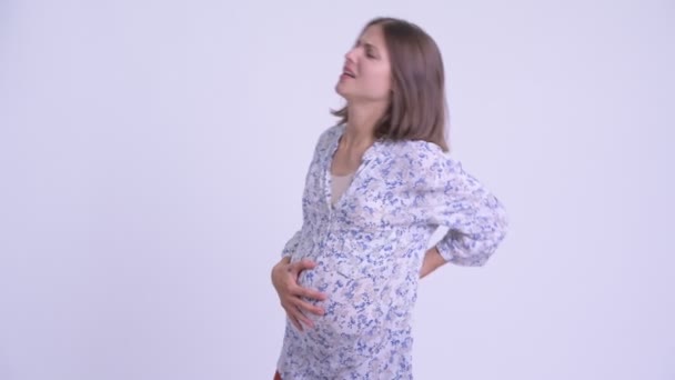 허리 통증을 가진 젊은 임신한 여자를 강조 — 비디오