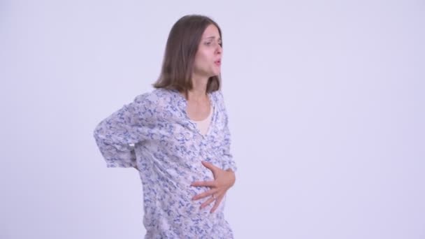 Stressed young pregnant woman having stomach ache — Stock Video