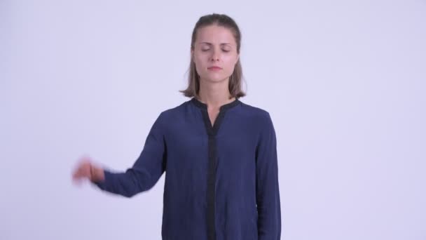 Sad young businesswoman giving thumbs down — Stock Video