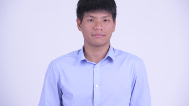 Rosto de feliz jovem empresário asiático sorrindo — Vídeo de Stock