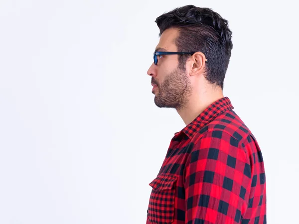 Profile view of handsome bearded Persian hipster man — Stock Photo, Image