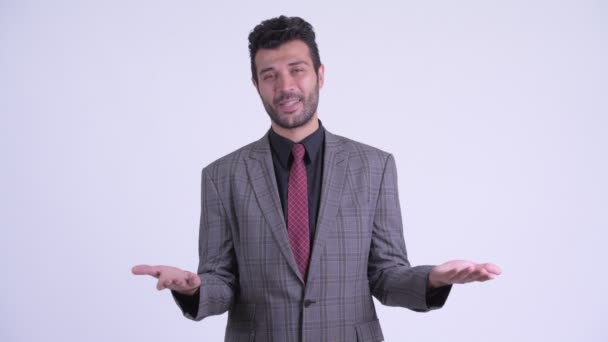 Verwirrter bärtiger persischer Geschäftsmann zuckt mit den Schultern — Stockvideo