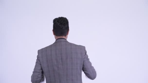 Visão traseira do empresário persa feliz com punhos levantados — Vídeo de Stock