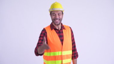 Mutlu sakallı Pers adam inşaat işçisi el sıkışma veren