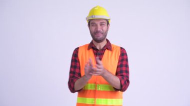 Mutlu sakallı Pers adam inşaat işçisi el çırpma