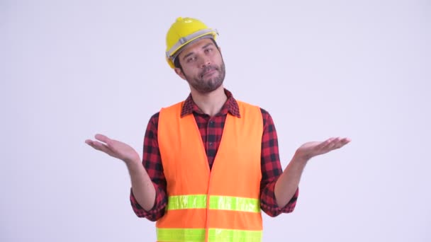 Confused bearded Persian man construction worker shrugging shoulders — Stock Video