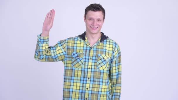 Feliz joven guapo hombre saludando la mano — Vídeo de stock