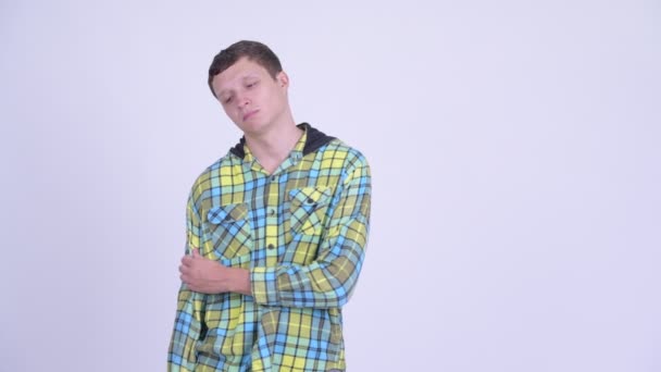 Depressed young man looking sad and upset — Stock Video