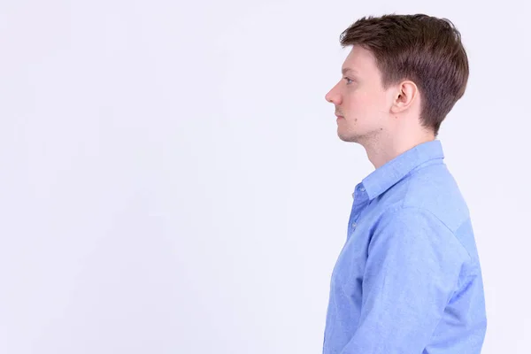 Vista de perfil de joven hombre de negocios guapo sobre fondo blanco —  Fotos de Stock