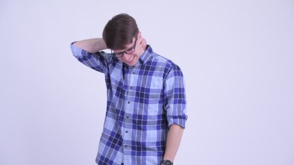 Stressed young hipster man having neck pain — Stock Video