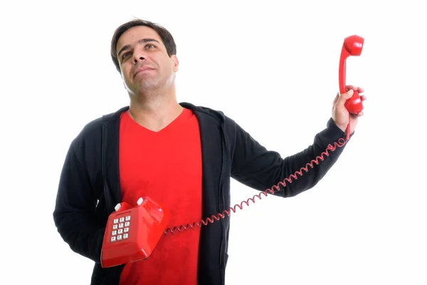 Studio Shot Thoughtful Young Persian Man Holding Old Telephone Away — 图库照片