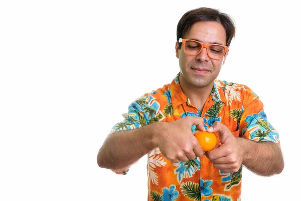 Studio Shot Young Persian Tourist Man Opening Orange While Wearing — Stok fotoğraf