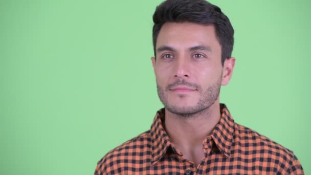 Face of happy young Hispanic hipster man thinking — Stock Video