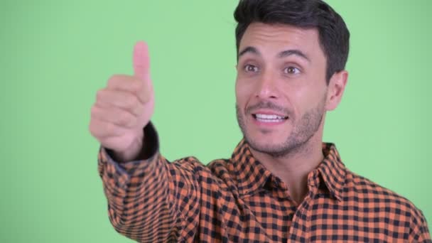 Face of happy young Hispanic hipster man giving thumbs up — Stock Video