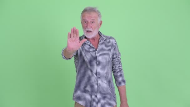 Serious senior bearded man showing stop gesture — Stock Video