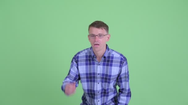 Portrait of happy hipster man getting good news — Stock Video