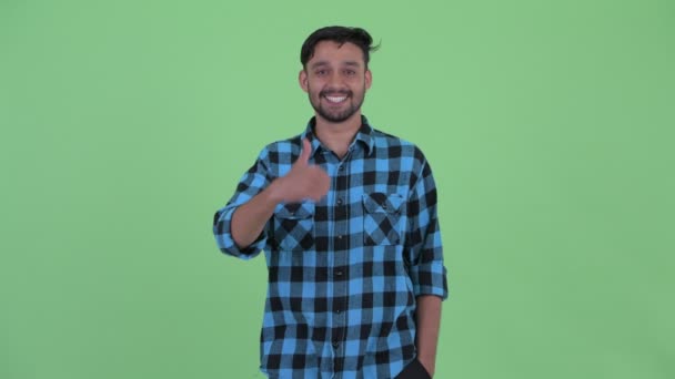 Щасливий молодий бородатий Перська хіпстера чоловік даючи великі пальці вгору — стокове відео