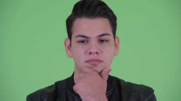 Face of stressed young multi ethnic man thinking and looking down — Stock Video