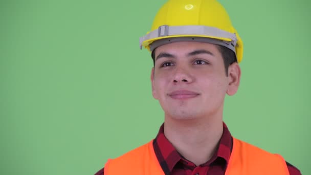 Face of happy young multi ethnic man construction worker thinking — Stock Video