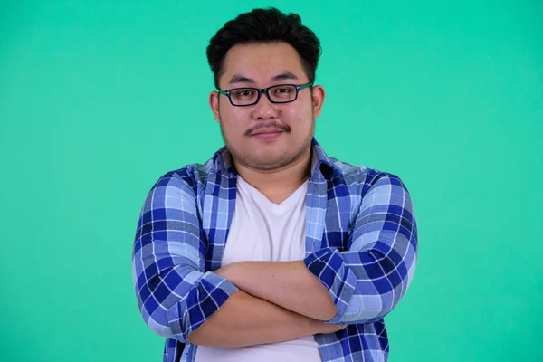 Young overweight Asian hipster man with arms crossed — Stock Photo, Image