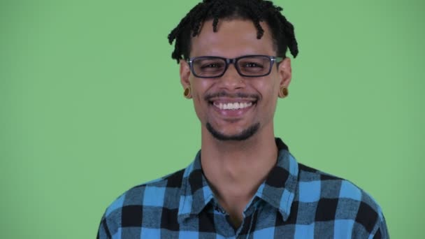 Face of happy young African hipster man smiling — Stock Video