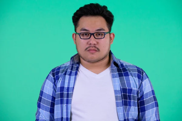 Face of young overweight Asian hipster man — Stock Photo, Image