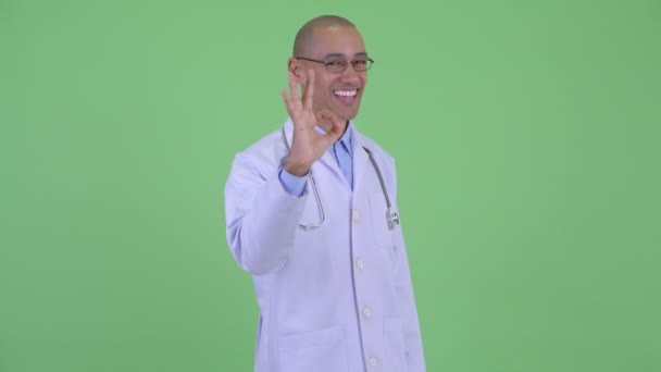 Happy bald multi ethnic man doctor with ok sign — Stock Video