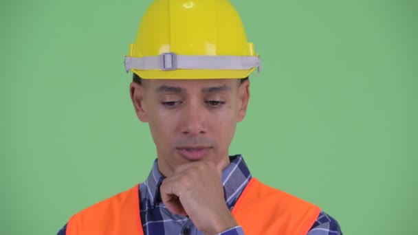 Face of stressed multi ethnic man construction worker thinking — Stock Video