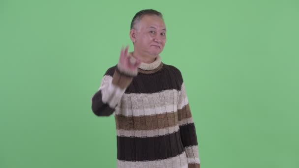 Happy mature Japanese man with ok gesture — Stock Video