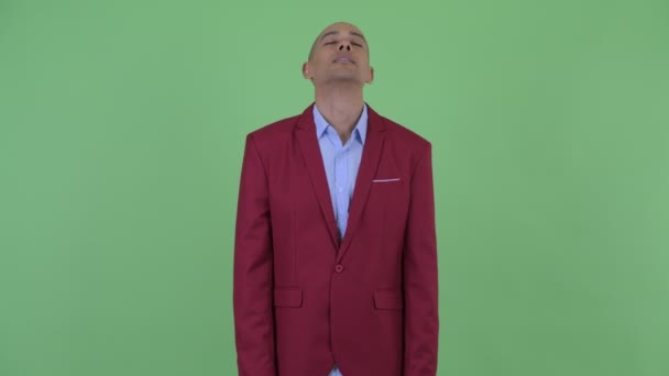 Happy bald multi ethnic businessman relaxing with eyes closed — Stock Video