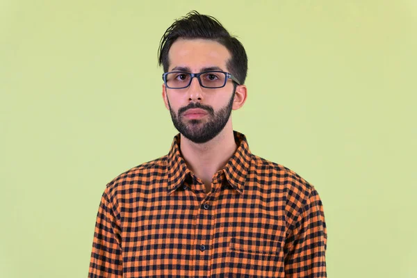 Face of young bearded Persian hipster man — Stock Photo, Image