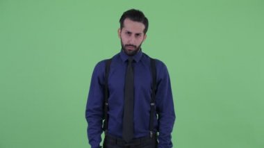 Üzgün Genç sakallı Pers işadamı vermek thumbs aşağı