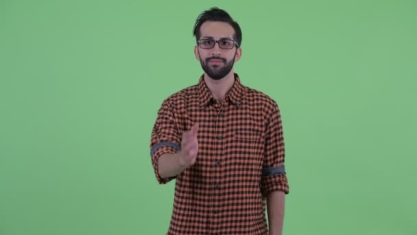 Heureux jeune barbu perse hipster homme donnant poignée de main — Video
