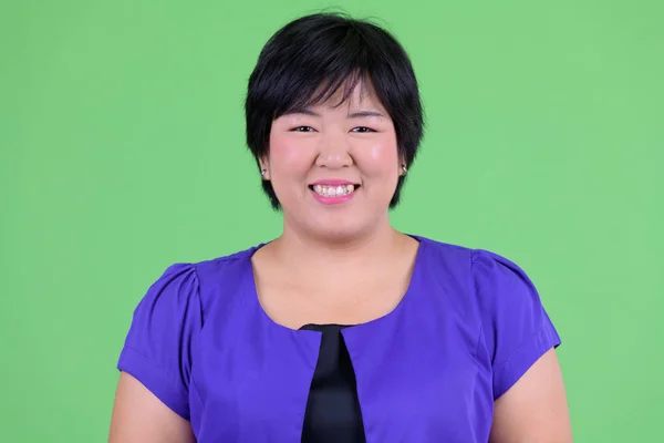 Face of happy young overweight Asian woman smiling — Stock Photo, Image