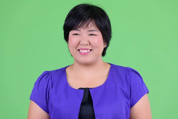 Face of happy young overweight Asian woman thinking — Stock Photo, Image