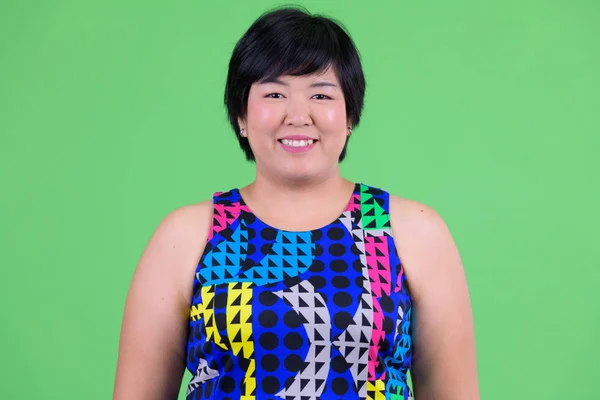 Volto di giovane felice sovrappeso donna asiatica sorridente pronto a festa — Foto Stock