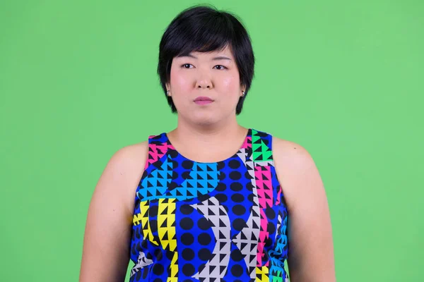 Face of young beautiful overweight Asian woman thinking ready to party — Stock Photo, Image