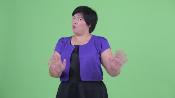Joven sobrepeso mujer asiática saludando mano no — Vídeos de Stock